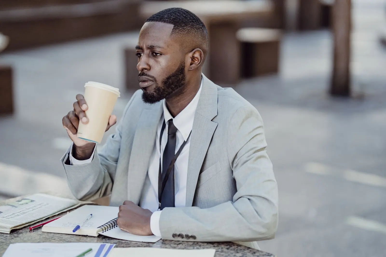 Nairobi business owner reviewing his company website over coffee